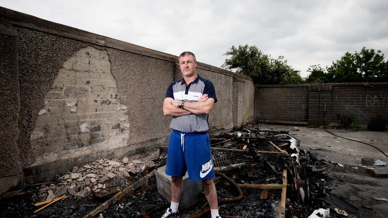 William McDonagh at his burnt-out caravan on St Mary’s Halting Site, Cappagh Road, Finglas, Dublin. Photograph: Tom Honan