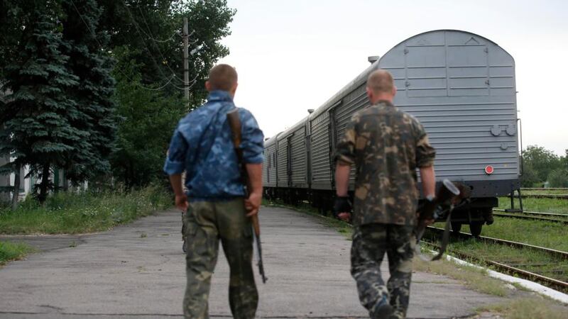 The train transporting the remains of victims from the crashed Malaysia Airlines MH17 flight departs from the railway station in the eastern Ukrainian town of Torez, Donetsk region today. Photograph:Maxim Zmeyev/Reuters