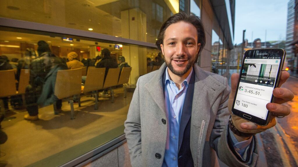 Mark Montgomerie with his app myq.ie outside the Garda National Immigration Bureau in Dublin – the app helps people save time when queuing for public services. Below: computer code can make life a lot easier. Photograph: Dara Mac Dónaill