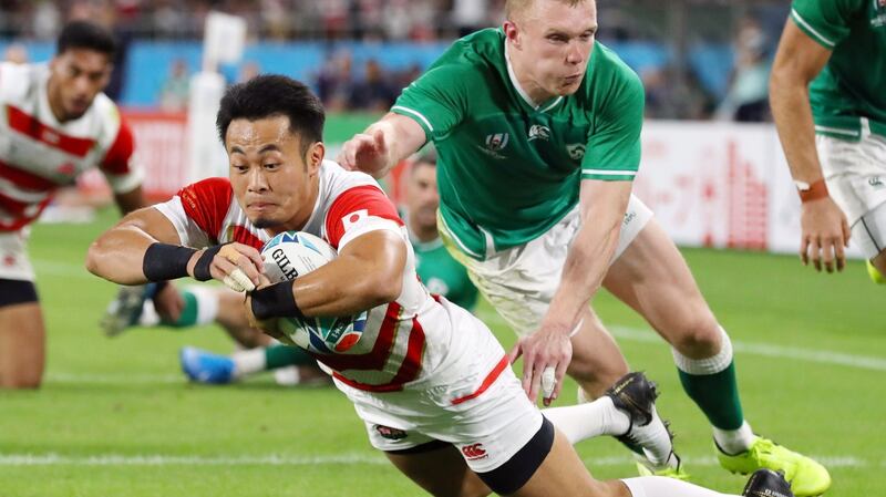 Kenki Fukuoka gets over for a try despite the attempts of Ireland’s Keith Earls at the Ecopa stadium. Photograph: EPA/JIJI