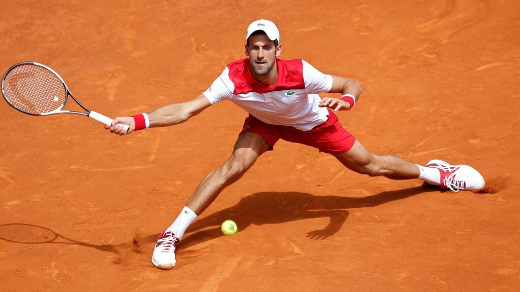 Novak Djokovic of Serbia returning to Kyle Edmund of Britain during the Madrid Open. Photograph: AP Photo/Paul White
