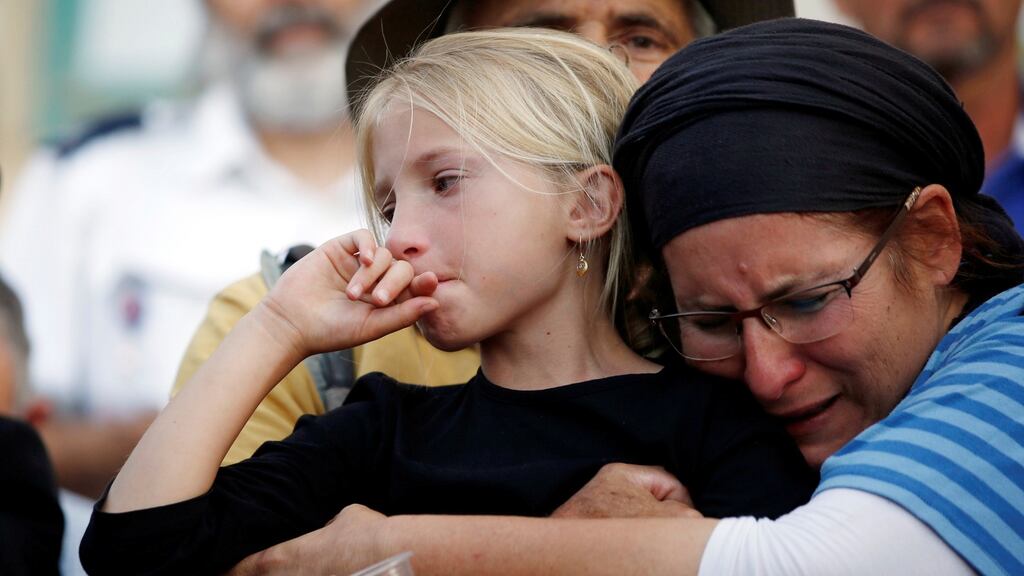 Mourners during the funeral of Israeli teenager Hallel Yaffa Ariel, at a cemetery in the West Bank city of Hebron. Photograph: Ronen Zvulun/Reuters