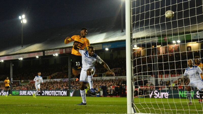 Jamille Matt leaps to score Newport County’s opener against Leicester. Photograph:Dan Mullan/Getty