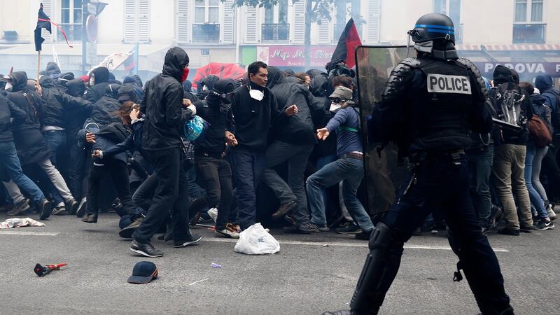 Protesters clash with riot police during a national demonstration and strike against the labour law reform in Paris. Photograph: Yoan Valat/EPA