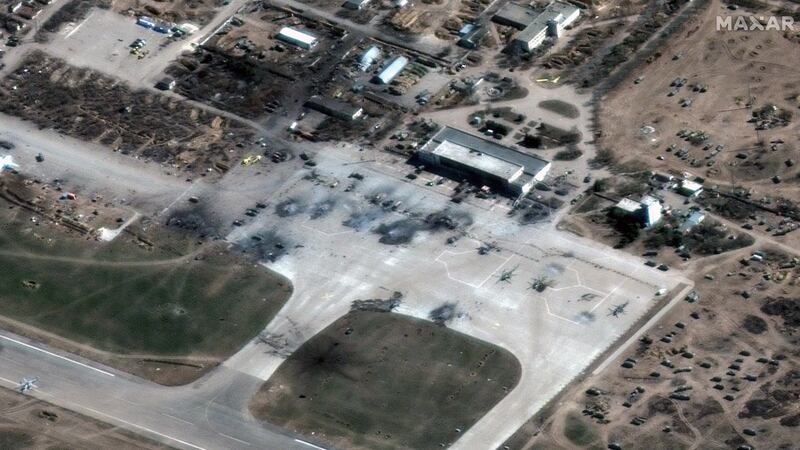 A satellite image provided by Maxar Technologies shows destroyed Russian helicopters on the tarmac at an airfield in Kherson, Ukraine, on Wednesday, March 16, 2022. Photograph: Satellite image ©2022 Maxar Technologies via The New York Times
