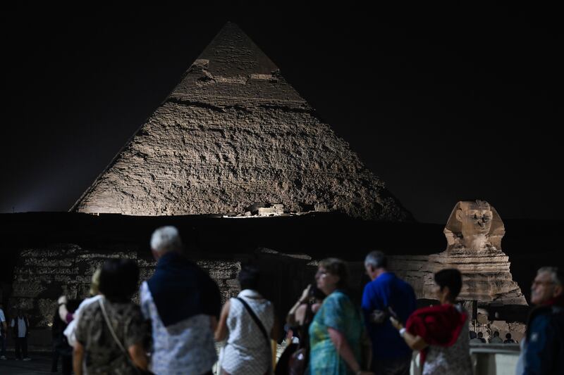 The Giza Pyramids and the Sphinx lit up for World Tourism Day, in Giza, Egypt. Photograph: Mohamed Hossam/EPA