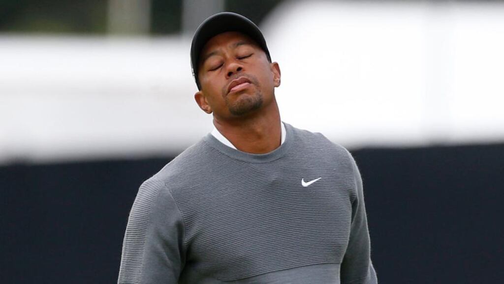 Tiger Woods reacts after missing a putt on day one of The Open Championship at St Andrews. He shot an opening 76. Photograph: Danny Lawso/PA .