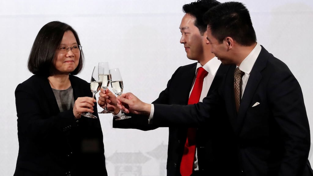Closer ties: Taiwan’s president Tsai Ing-wen toasts with American Chamber of Commerce in Taipei chairman Albert Chang and Alex Wong, US deputy assistant secretary at the Bureau of East Asian and Pacific Affairs.  Photograph: Reuters/Tyrone Siu