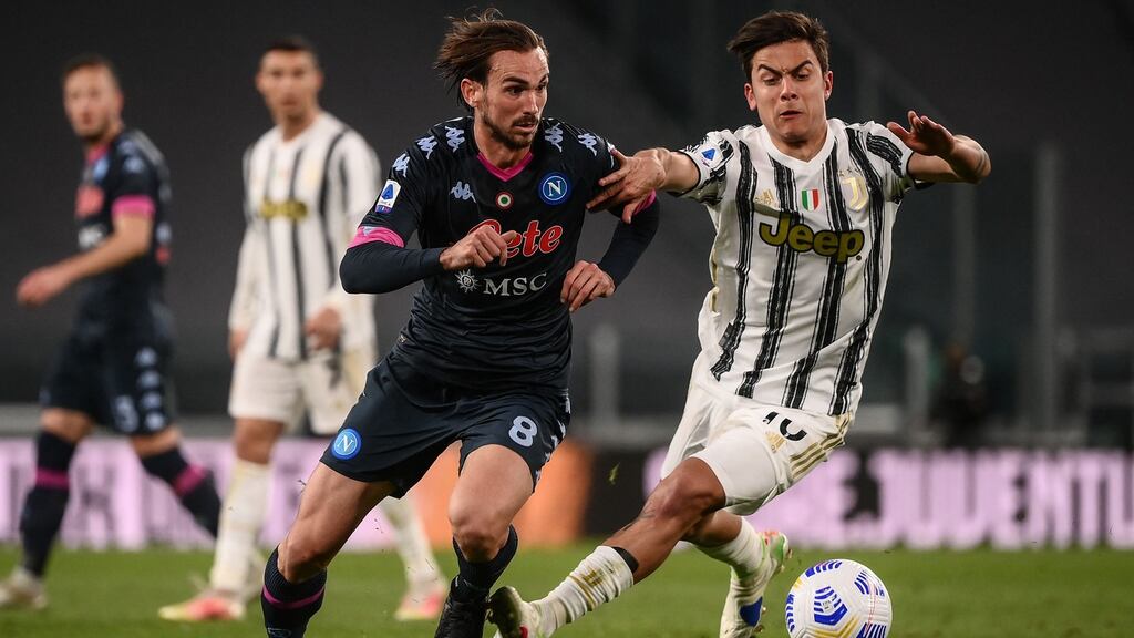 Juventus forward Paulo Dybala, right, challenges Napoli midfielder Fabian Ruiz on Wednesday night in Turin. Photograph: Marco Bertorello/AFP