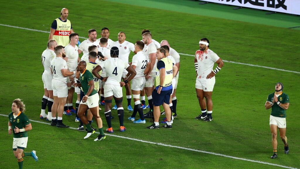 The English players stand dejected after South Africa’s first try. Photo: Michael Steele/Getty Images