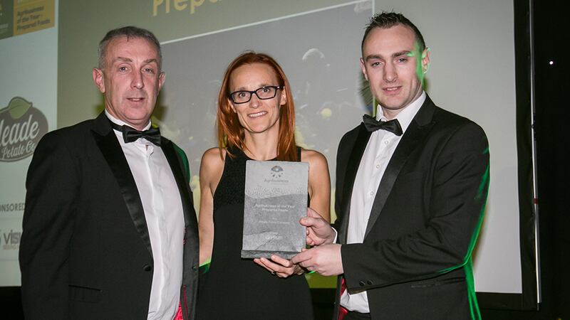 Oonagh Mc Nerney, Co - founder & CEO, Visum presents the Agribusiness of the Year – Prepared Foods award to Robert Devlin and Patrick Meade, Meade Potato Company