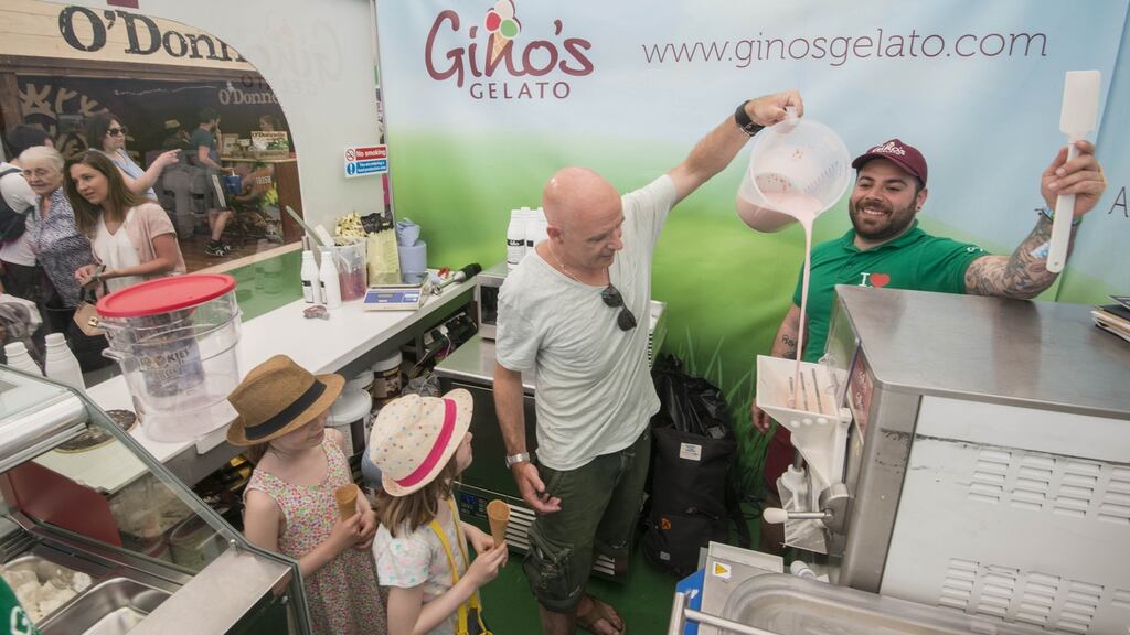 Conor Pope with his children Molly (9) and Juliette (7), with Alfredo Dona of Gino’s Gelato at Bloom earlier this month. Photograph: Brenda Fitzsimons