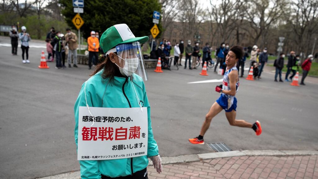 A volunteer pictured during a half-marathon in Sapporo which doubled as a test event for the Tokyo Olympics. Photograph: Charly Triballeau/Getty/AFP