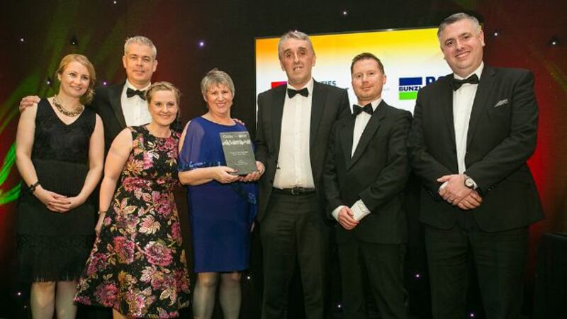 Roger O’Shea, Commercial and Operational Manager, Electro Solutions presents the Property Management Team of the Year award to AIB Estate Management Team