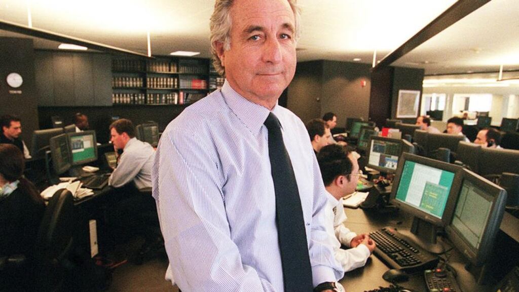 Bernard L. Madoff, chairman of Madoff Investment Securities is seen on his Manhattan trading floor in this photo taken Dec. 30, 1999 in New York. The former Nasdaq stock market chairman was arrested on a securities fraud charge in 2008, accused of running a phony investment business that amounted to nothing more than a “giant Ponzi scheme.” (Photograph: AP Photo/The New York Times, Ruby Washington)