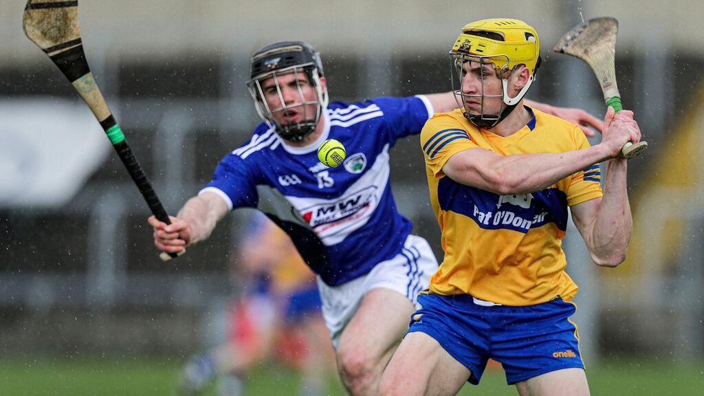 Clare’s Rory Hayes and PJ Scully of Laois tussle during their Allianz Hurling League clash. Photo: Brian Reilly-Troy/Inpho