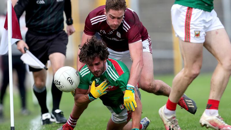 Mayo’s Mark moran is tackled by Galway’s Gary O’Donnell. Photograph: Bryan Keane/Inpho