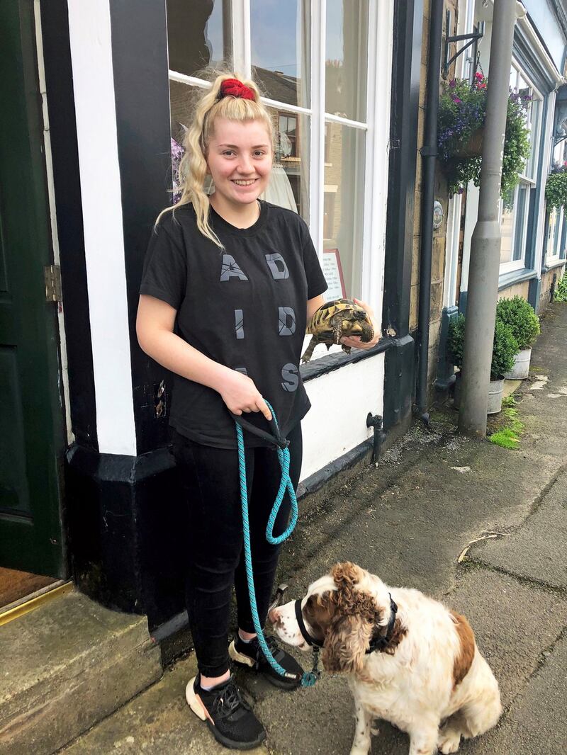 Anna Coleman, 18, with her tortoise Nelly and dog Henry, who were evacuated with her and her family on Thursday near the village of Whaley Bridge, Derbyshire. Photograph: Eleanor Barlow/PA Wire