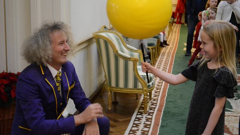 Con Horgan of the Fanzini Brothers entertains children at an event to switch on the Christmas tree lights by President Michael D Higgins at Áras an Uachtaráin on Saturday. Photograph: Hajar Akl