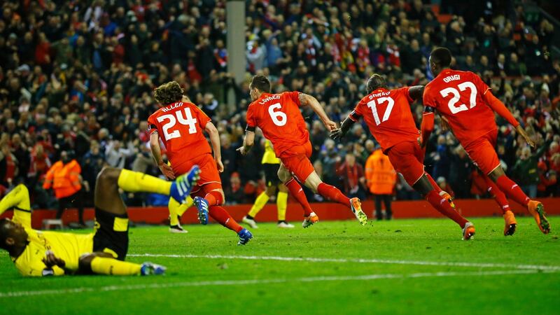 Dejan Lovren runs off  to celebrate with team-mates after scoring the winning goal during the Europa League quarter-final second leg against Borussia Dortmund at Anfield. Photograph: Darren Staples/Reuters/Livepic