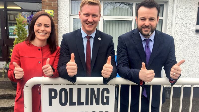 SDLP handout of candidate Daniel McCrossan outside Strabane County primary school after casting his vote in the West Tyrone parliamentary byelection, flanked by SDLP leader Colum Eastwood and deputy leader Nichola Mallon. Photograph: SDLP/PA Wire