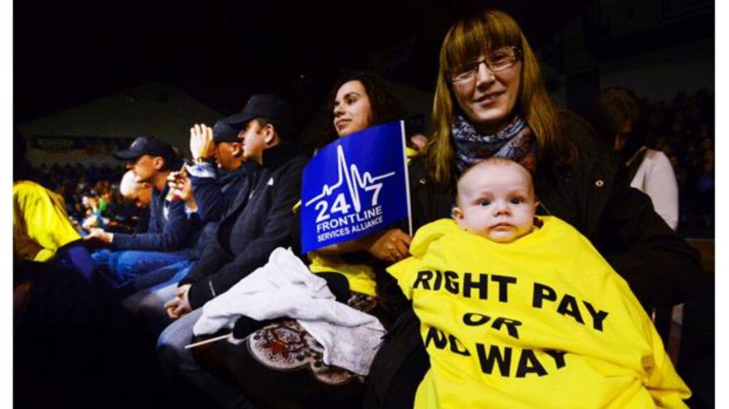 Frontline staff rallying against Government proposals to reduce premium payments last night