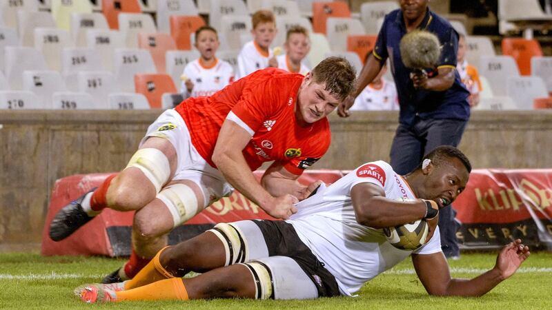 Junior Pokomela of the Cheetahs scores a try despite the efforts of Munster’s Jack O’Donoghue during the Guinness Pro 14 match at the Toyota Stadium in Bloemfontein. Photograph: Frikkie Kapp/Inpho