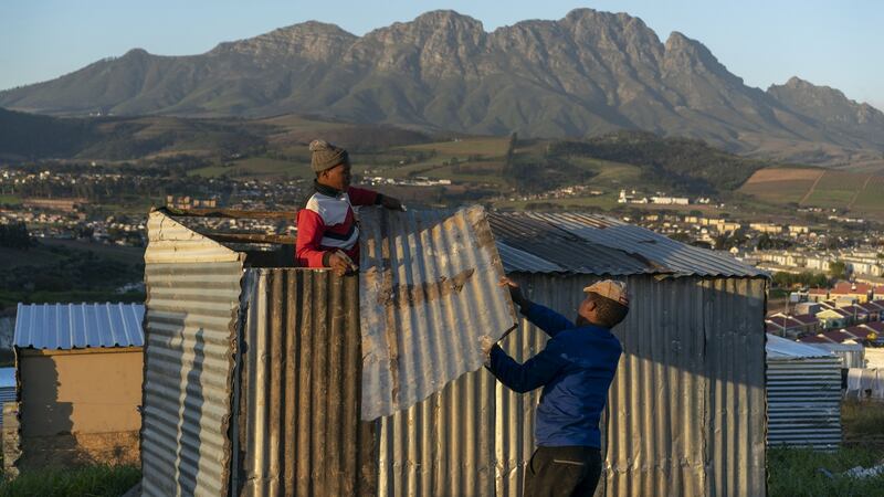 Building a shack near the township of Kayamandi, where newcomers arrive daily, mostly from the impoverished Eastern Cape Province, in Stellenbosch, South Africa. Photograph: Joao Silva/The New York Times