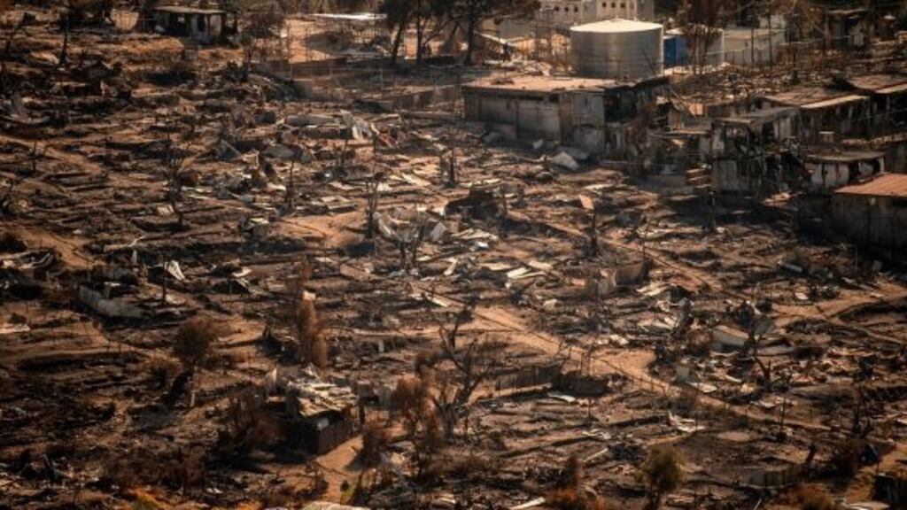 Remains of the burnt-out Moria migrant camp on the Greek Aegean island of Lesbos. Photograph: Angelos Tzortzinis/AFP Remains of the burnt-out Moria migrant camp on the Greek Aegean island of Lesbos. Photograph: Angelos Tzortzinis/AFP