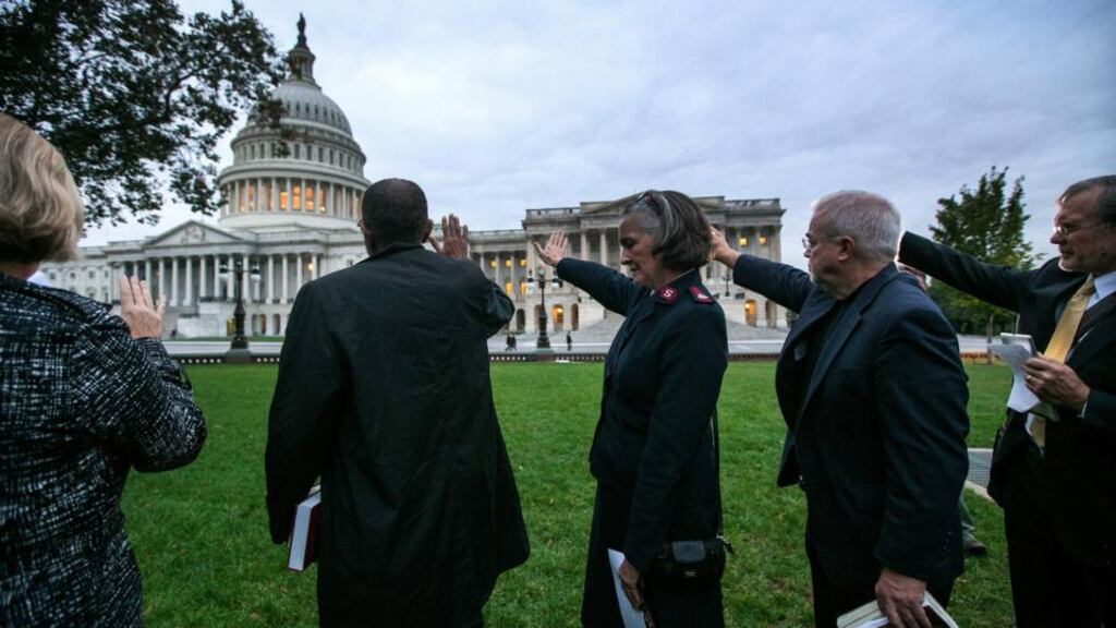 Religious leaders pray outside the Capitol on Wednesday, the 16th day of the government shutdown in Washington. Photograph: Doug Mills/The New York Times