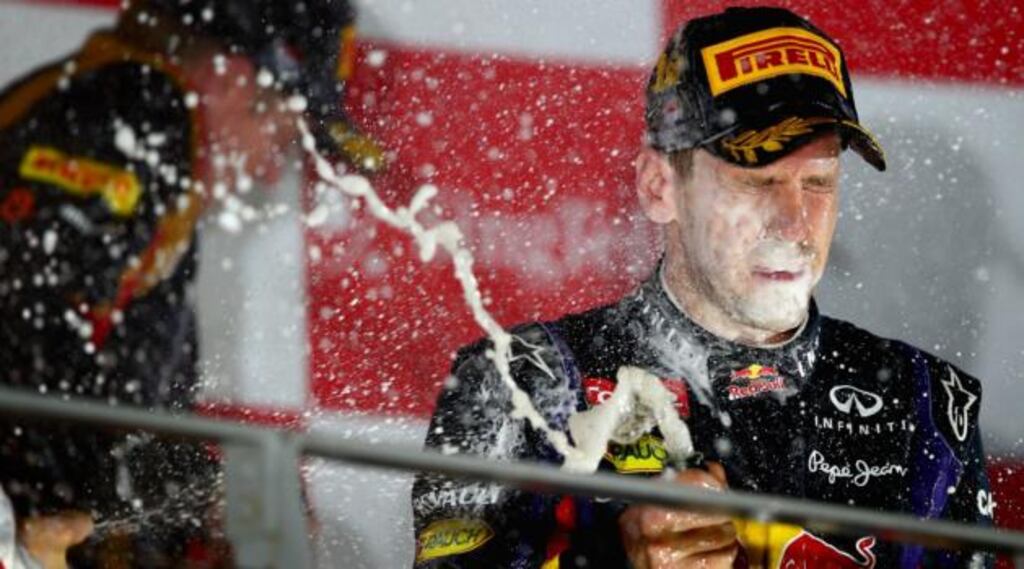Sebastian Vettel of Germany and Infiniti Red Bull racing celebrates after his victory in the Singapore Grand Prix at Marina Bay Street Circuit. Photograph: Clive Mason/Getty Images
