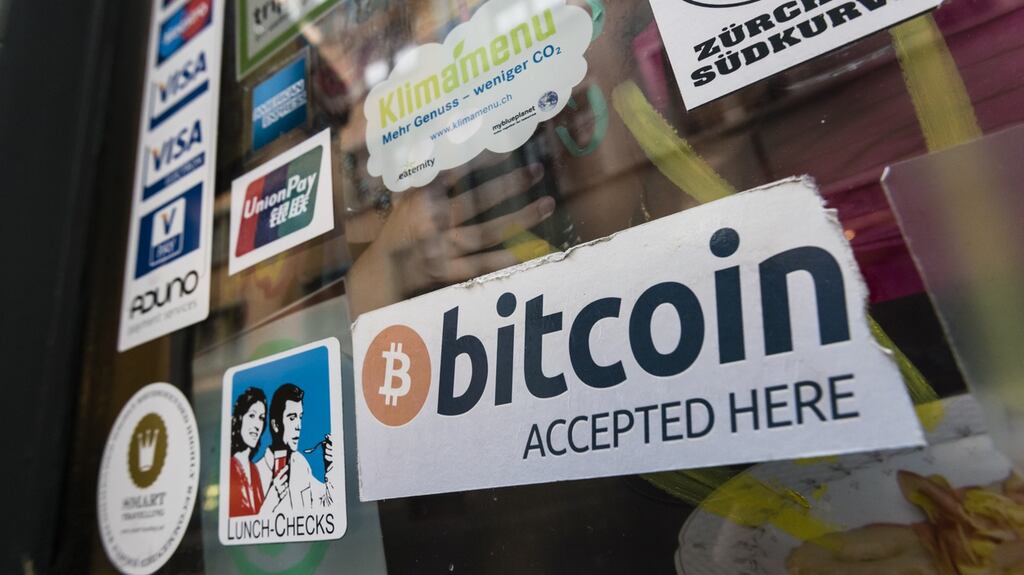 “Bitcoin accepted” sign in the window of a cafe in Zurich. Photograph: iStock