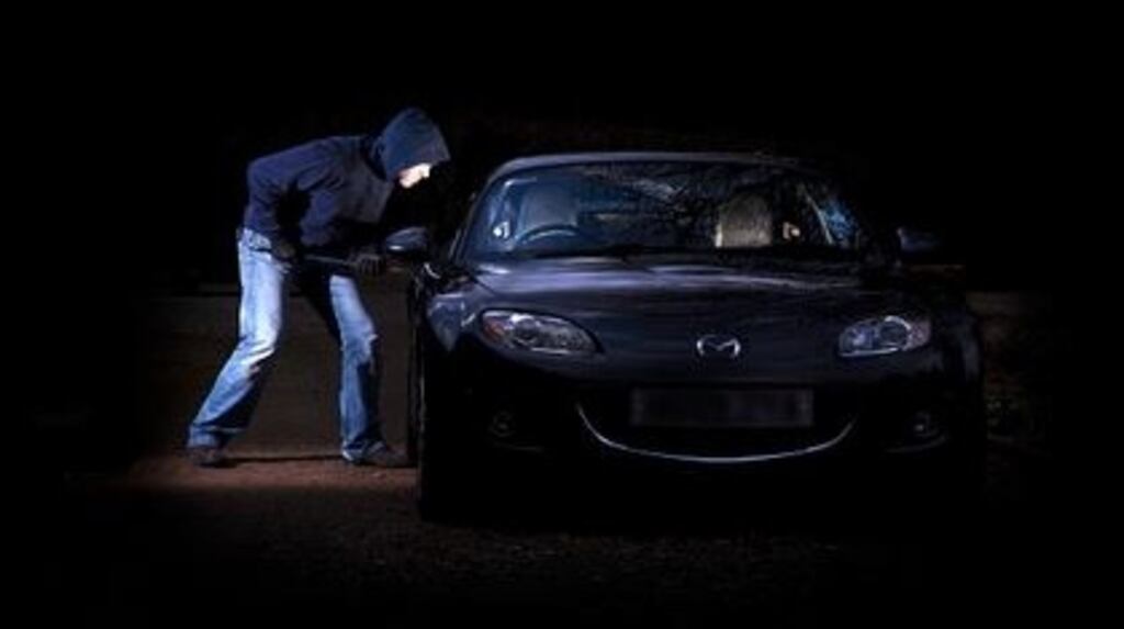 File image of a man seeking to steal a car. Gardaí are investigating a suspected crime network specialising in breaking into houses to steal car keys before driving off in the vehicles. File photograph: Getty Images