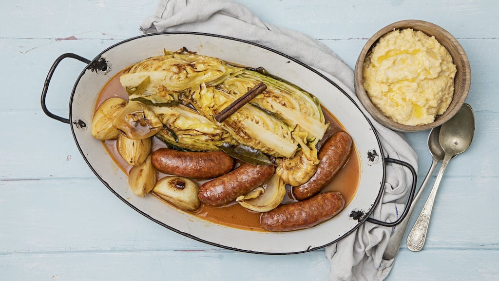 Pot roast Italian sausages with spring cabbage and polenta. Photograph: Harry Weir