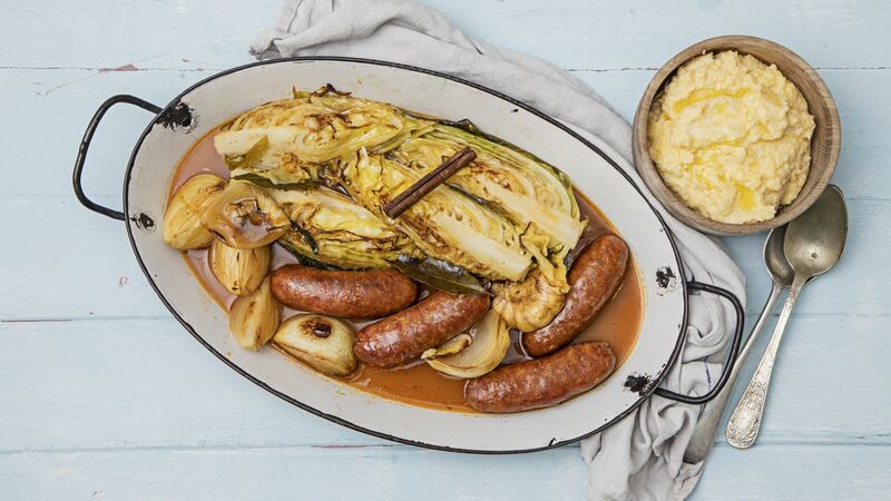 Pot roast Italian sausages with spring cabbage and polenta. Photograph: Harry Weir