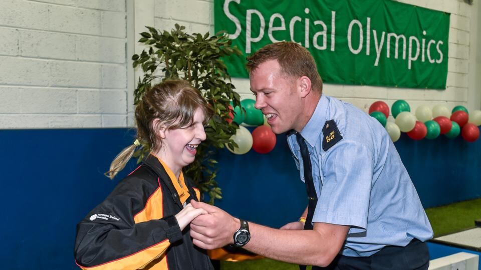 Bocce athlete Phoebe Dalrymple from Ballymena, Co Antrim dances with Garda Dermot Keating from Henry St Garda Station in Limerick after a medal ceremony. Photograph: Diarmuid Greene/Sportsfile