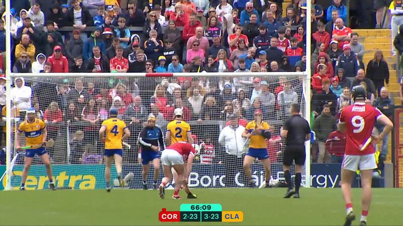 Patrick Horgan lashes a free to the Clare net while two players still have their backs to the ball, during their Munster SHC clash