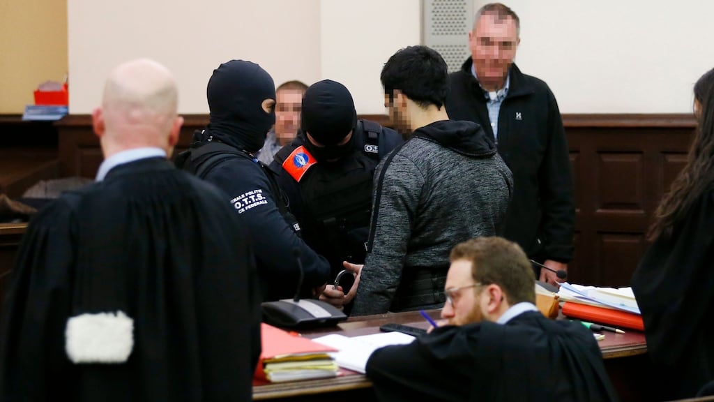 Salah Abdeslam  is escorted by Belgian police officers at his trial in Brussels after a shootout that led to his capture in the Belgian capital in  2018. Photograph: Francois Lenoir/AFP/Getty