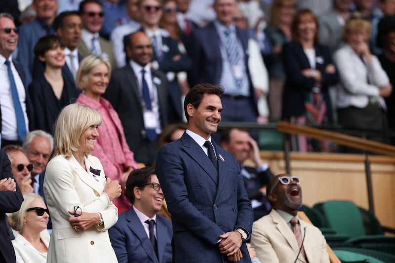 Roger Federer looks on as Novak Djokovic and Alex de Minaur battle it out in Centre Court. Photograph: Adrian Dennis/AFP via Getty Images
