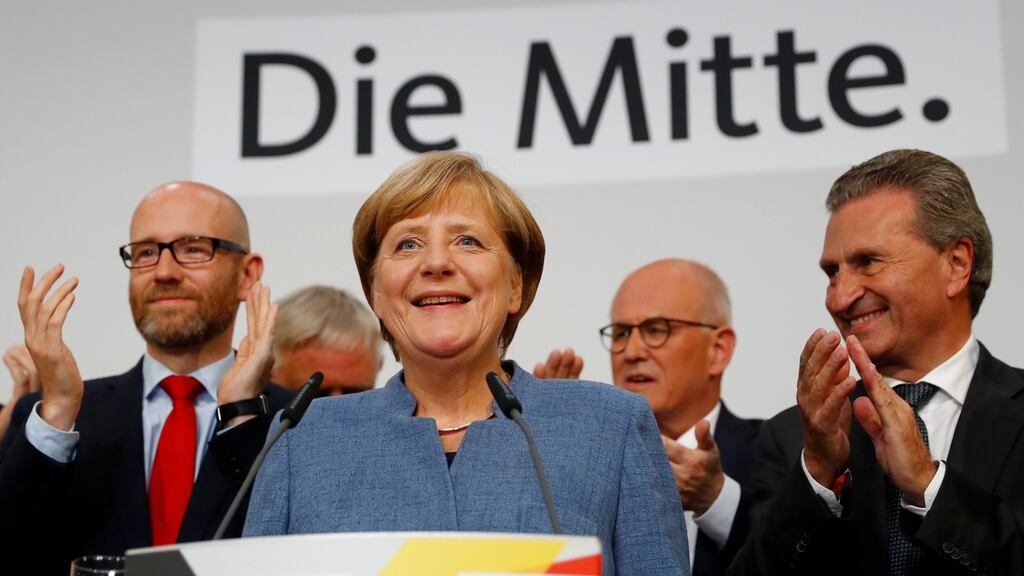 Christian Democratic Union party leader and German Chancellor Angela Merkel reacts on first exit polls in the German general election in Berlin. Photograph: Kai Pfaffenbach/Reuters
