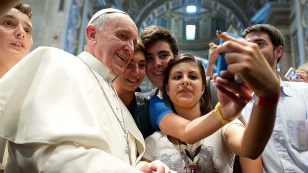 One of the most famous selfies this year was the Pope posing with teenagers at the Vatican.