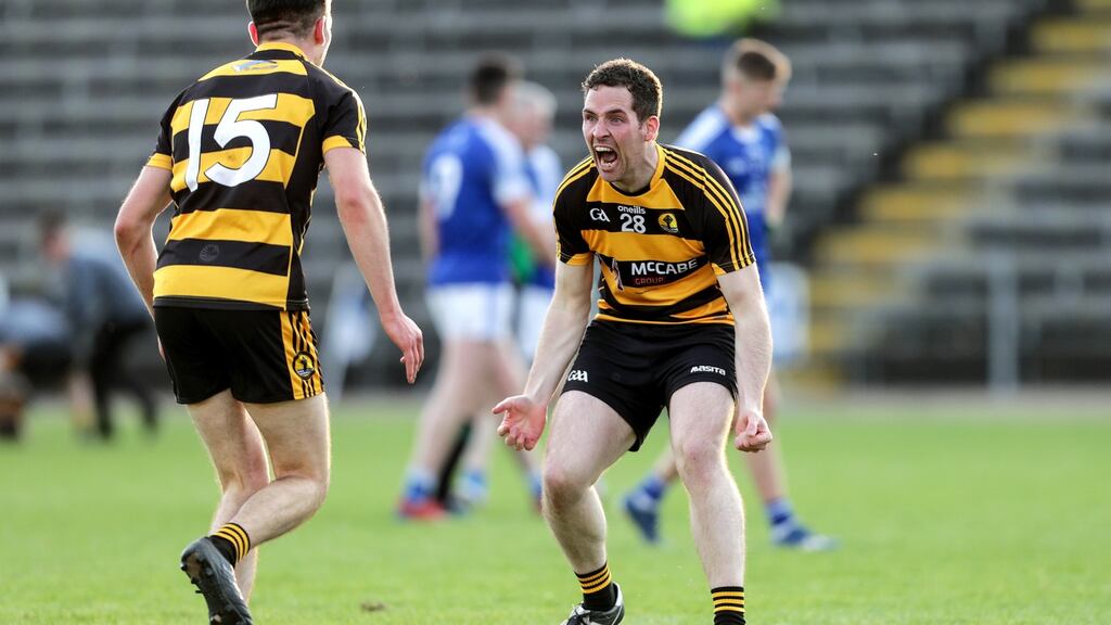 Crosserlough’s Barry McKiernan celebrates at the final whistle with Stephen Smith. Photo: Laszlo Geczo/Inpho