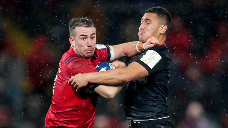 Munster’s JJ Hanrahan is tackled by Manu Vunipola of Saracens. during the Heineken Champions Cup match at Thomond Park. Photograph: Oisín Keniry/Inpho