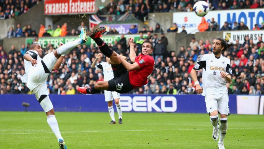 Robin van Persie of Manchester United scores his sides opening goal against Swansea City at Liberty Stadium. Photograph: Michael Steele/Getty Images
