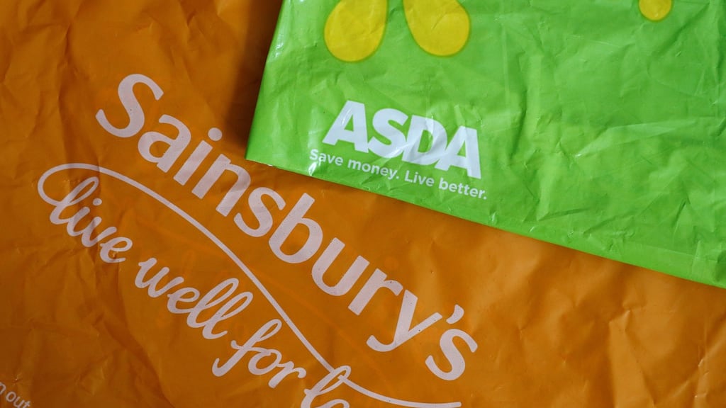 Shopping bags from Asda and Sainsbury’s. Their merger shook up retail stocks on Monday. Photograph: Reuters/Phil Noble