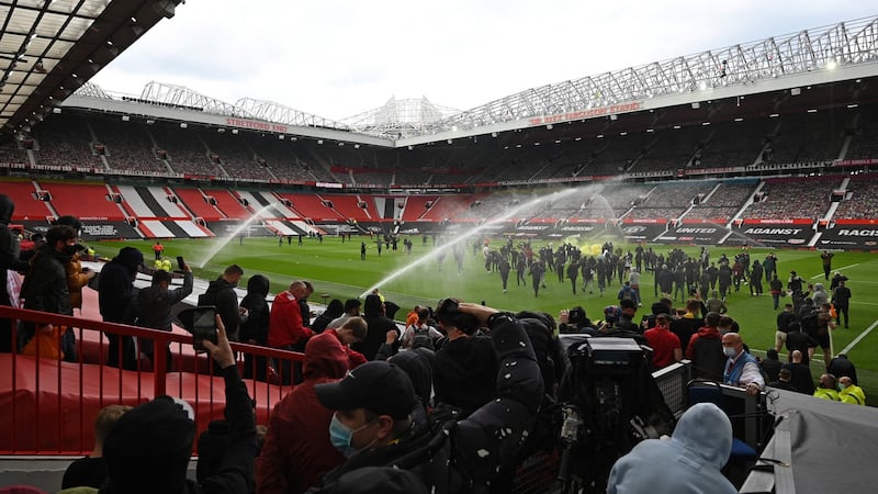 Supporters broke into the ground. Photo: Oli Scarff/AFP via Getty Images