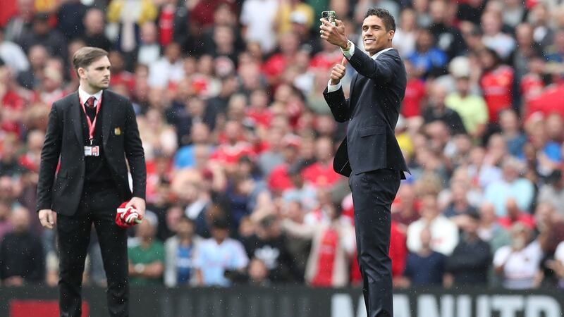 New Manchester United signing Raphael Varane is introduced to fans at Old Trafford ahead of the Leeds game. Photograph: Alex Morton/Getty Images