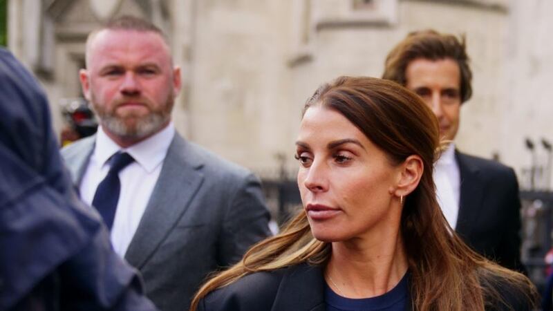 Coleen Rooney and her husband Wayne at the court in London on Tuesday. Photograph: Victoria Jones/PA Wire