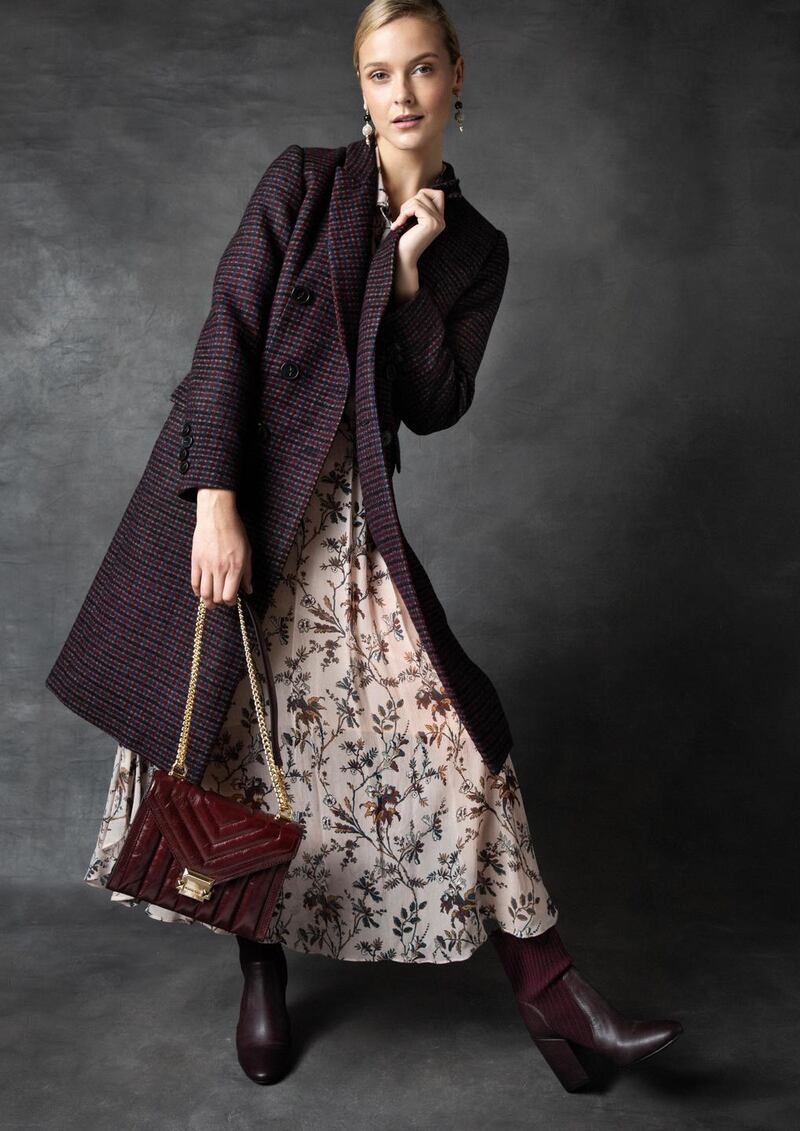 Check coat DMN €690, floral dress Pablo €295, burgundy leather bag Michael Michael Kors €350, Tribute drop earrings Lulu Frost at Loulerie €349, burgundy boot Vince Camuto €150