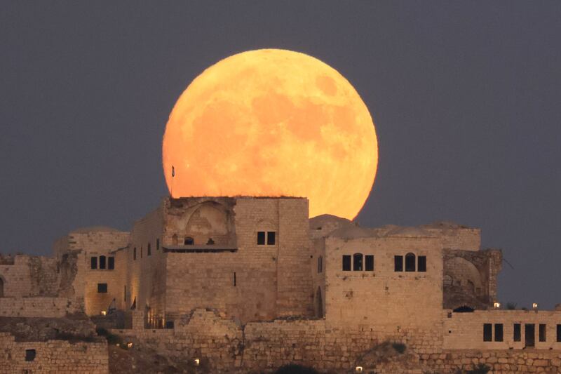 The super blue moon rises above an ancient fortress in Migdal Tsedek National Park near Rosh Haayin, Israel. Photograph: EPA-EFE